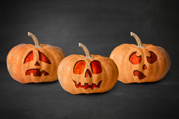 Pumpkin carved into spooky demon face for haloween