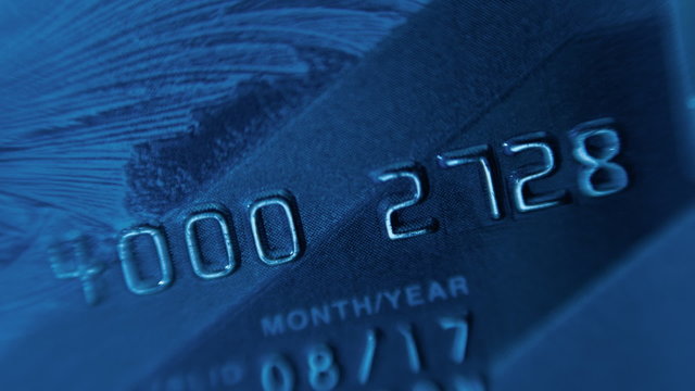 Plastic credit cards to withdraw money from a bank account