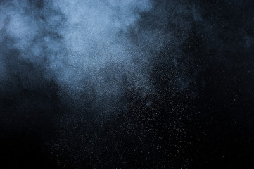 abstract white dust explosion  on black background. abstract white powder explosion  on black background
