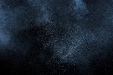 abstract white dust explosion  on black background. abstract white powder explosion  on black background - obrazy, fototapety, plakaty