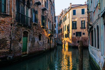 Obraz na płótnie Canvas Narrow canal among old houses, Venice, Italy.
