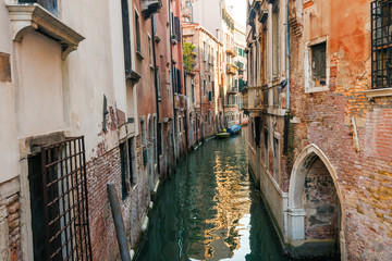 Boats, water canal and traditional buildings, Venice. Italy, Europe.