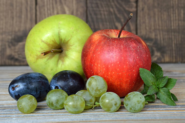 Autumn fruits on wooden background