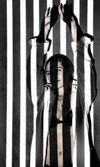 Beautiful woman covered with black and white lines