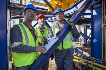 Crew onboard a ship inspecting with clipboard