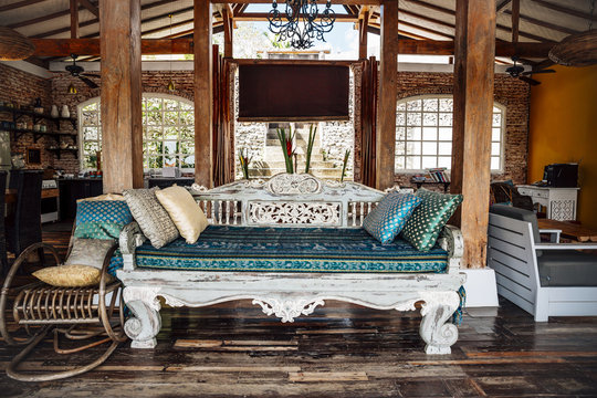 Indonesia, Bali, wooden classic Indonesian daybed in a holiday villa
