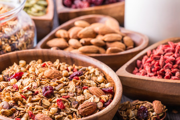 Obraz na płótnie Canvas Homemade granola with milk, berries, seeds and nuts