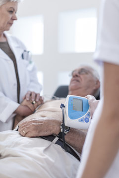 Senior man doing check up in hospital, looking worried
