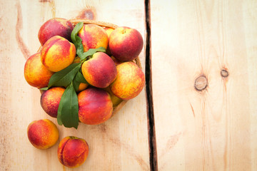 Nectarines on wooden table