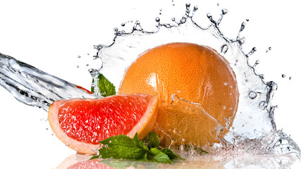 Water splash on grapefruit with mint isolated