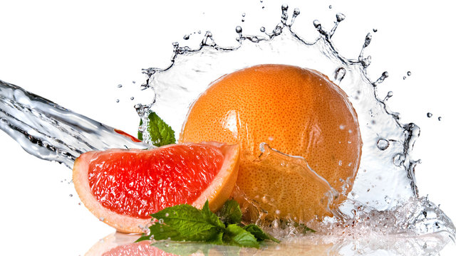 Water splash on grapefruit with mint isolated © artjazz