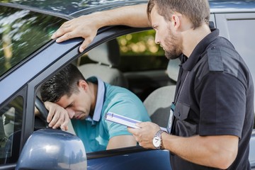 Sad man in car