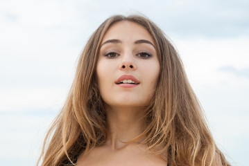 Closeup portrait of beautiful amazed girl outdoor