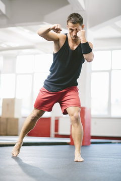 Man training Group Fitness with elements of Kami Bo
