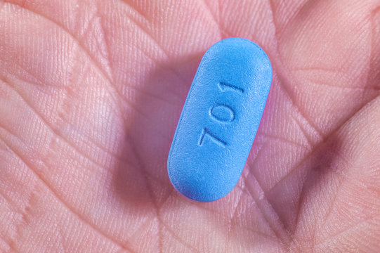 Hand holding Pill used for Pre-Exposure Prophylaxis (PrEP) to prevent HIV