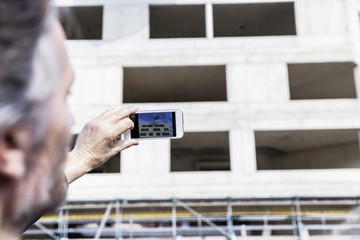 Man taking picture on construction site