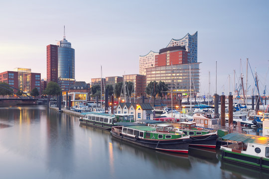 Germany, Hamburg, Elbphilharmonie and harbor at dusk