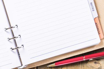 Office supplies. With a ballpoint pen.