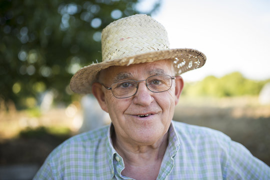 Portrait of smiling farmer with straw hat