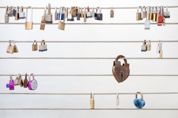 Love Locks Hanging from a Cable Railing