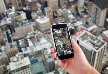 NYC aerial view through smartphone screen