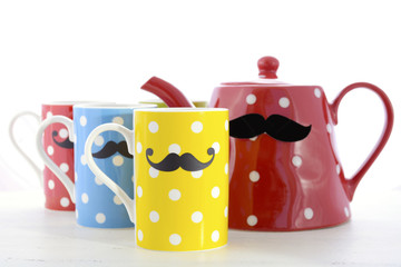 Colorful coffee mugs with mustaches.