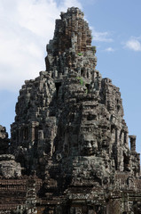 Ancient stone faces Bayon temple in Angkor Thom, Siemreap, Cambo