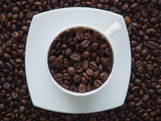 Cup with coffee beans
