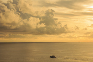 Landscape of cloudy sky and sea which has a boat on sea water in Phuket Thailand