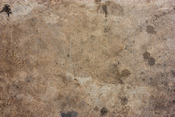 Cement floors are old and dirty.