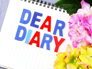 dear diary word on white paper notebook concept background