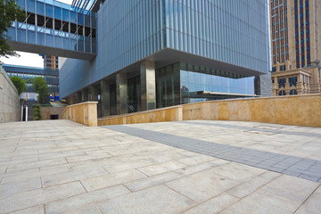 Empty road surface with modern office buildings background