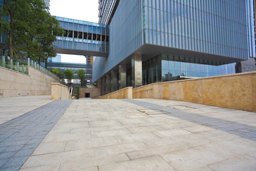 Empty road surface with modern office buildings background