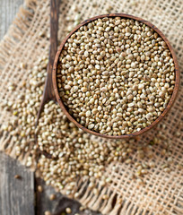 Fototapeta premium hemp seeds on wooden surface