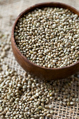 hemp seeds on wooden surface