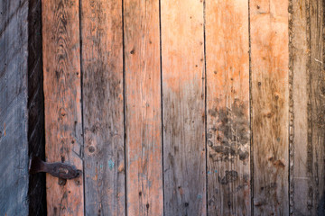 Old wooden door in the evening. The texture and color of the door.