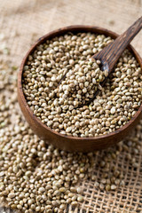 hemp seeds on wooden surface