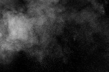 abstract white dust explosion  on a black background. abstract white powder. design elements. abstract texture.