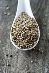 hemp seeds on wooden surface