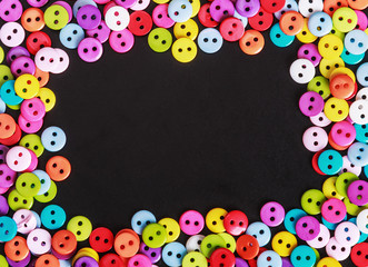 Multicolored buttons on a black background