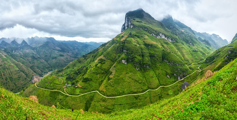 Unique bow Ma Pi Leng Pass, Ha Giang, Vietnam with clouds majestic mountains all year round attracting your soul to behold - obrazy, fototapety, plakaty