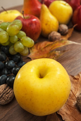 Naklejka na ściany i meble Fruit on old plank, grape, apples and pear