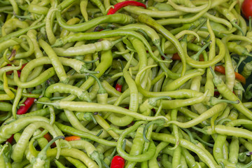 Closeup to a Large Amount of Green Chilli Peppers