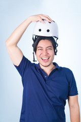 Asian guy with bicycle helmet and gloves