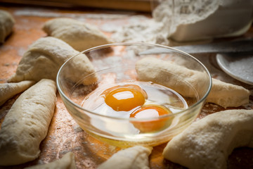 Preparation of bread and rolls in the kitchen. Kneading