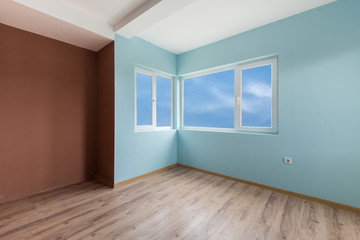 Empty blue room with windows and a door (includes clipping path)