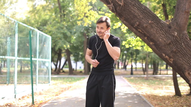 Runner stick headphones, includes music and starts running