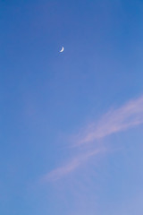 Crescent moon in sky