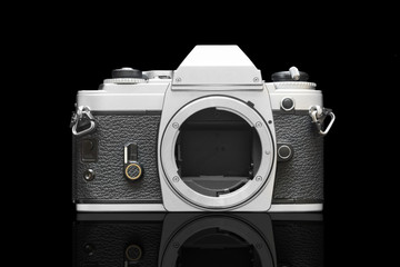 Slr Camera Isolated On Black Background With Mirror Effect