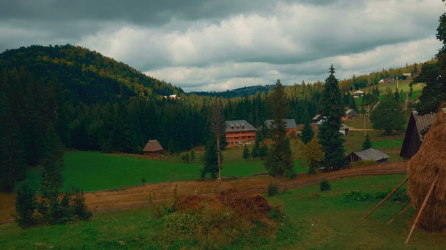 A wide angle pastoral scene in the Romanian countryside on an overcast day

